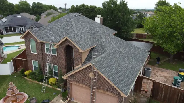 Frame Restoration residential roofing documentation showing a shingle roof and access ladders