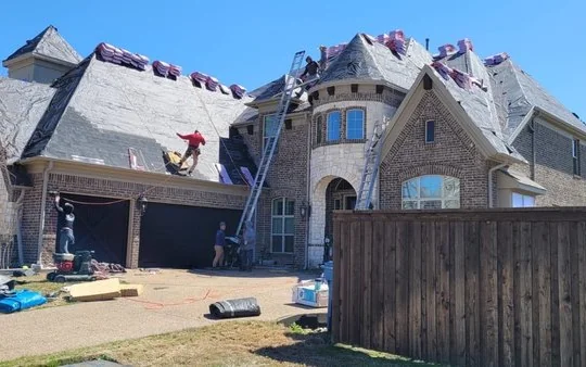 Frame Restoration crew working on a steep residential roof in North Texas